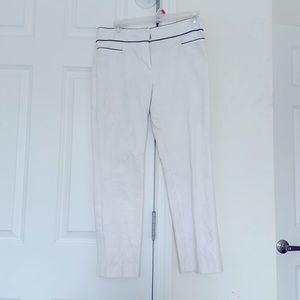 Ann Taylor size 0 white dress capris with black lined pockets and waist.